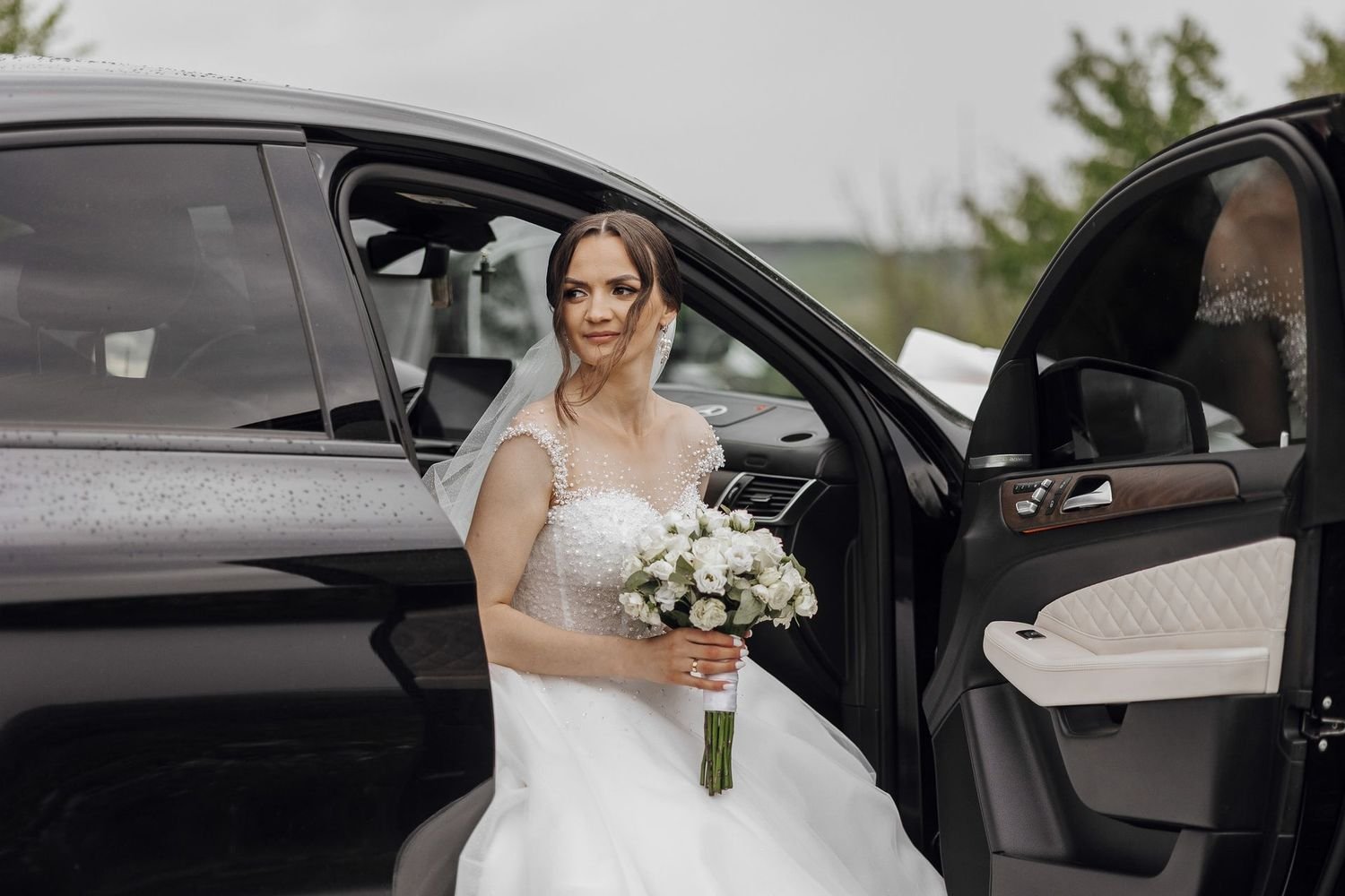Bride in white dress holding bouquet